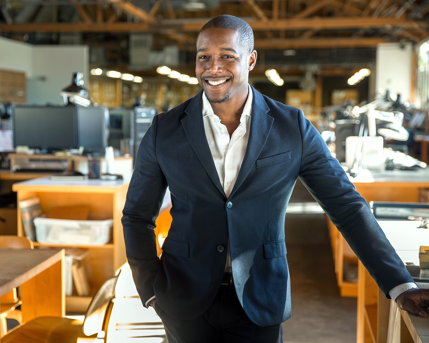 Banker is standing in a office with smile